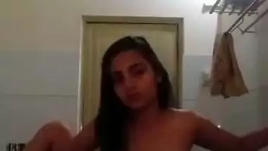 Indian nude MMS of an 18-year-old girl fingering in a bathroom