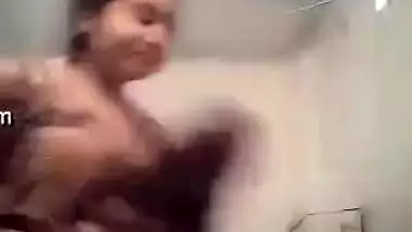 Plump Desi girl undresses to show her perky XXX boobies to lover