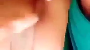 Horny girl squeezes her boobs and fingers her hairy pussy