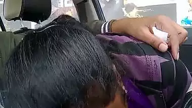 Telugu woman gives a desi blowjob to her man in a car