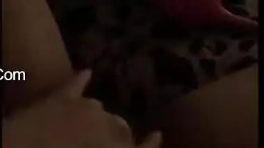 Young gal in red lingerie teases her XXX Desi pussy for the camera